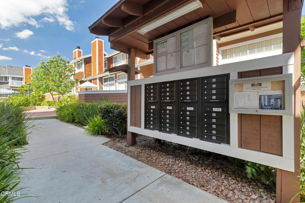 19431 Sherman Way, Unit 6 Reseda, CA 91335 - Photo 8 of 31 a couple of potted plants in front of door
