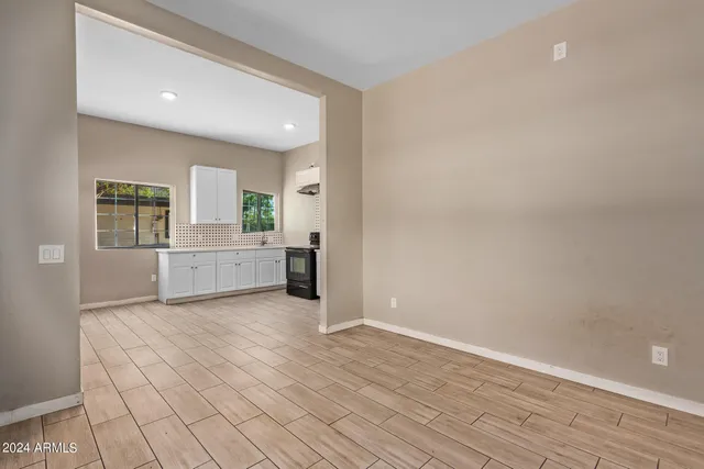 a view of a kitchen with microwave and cabinets