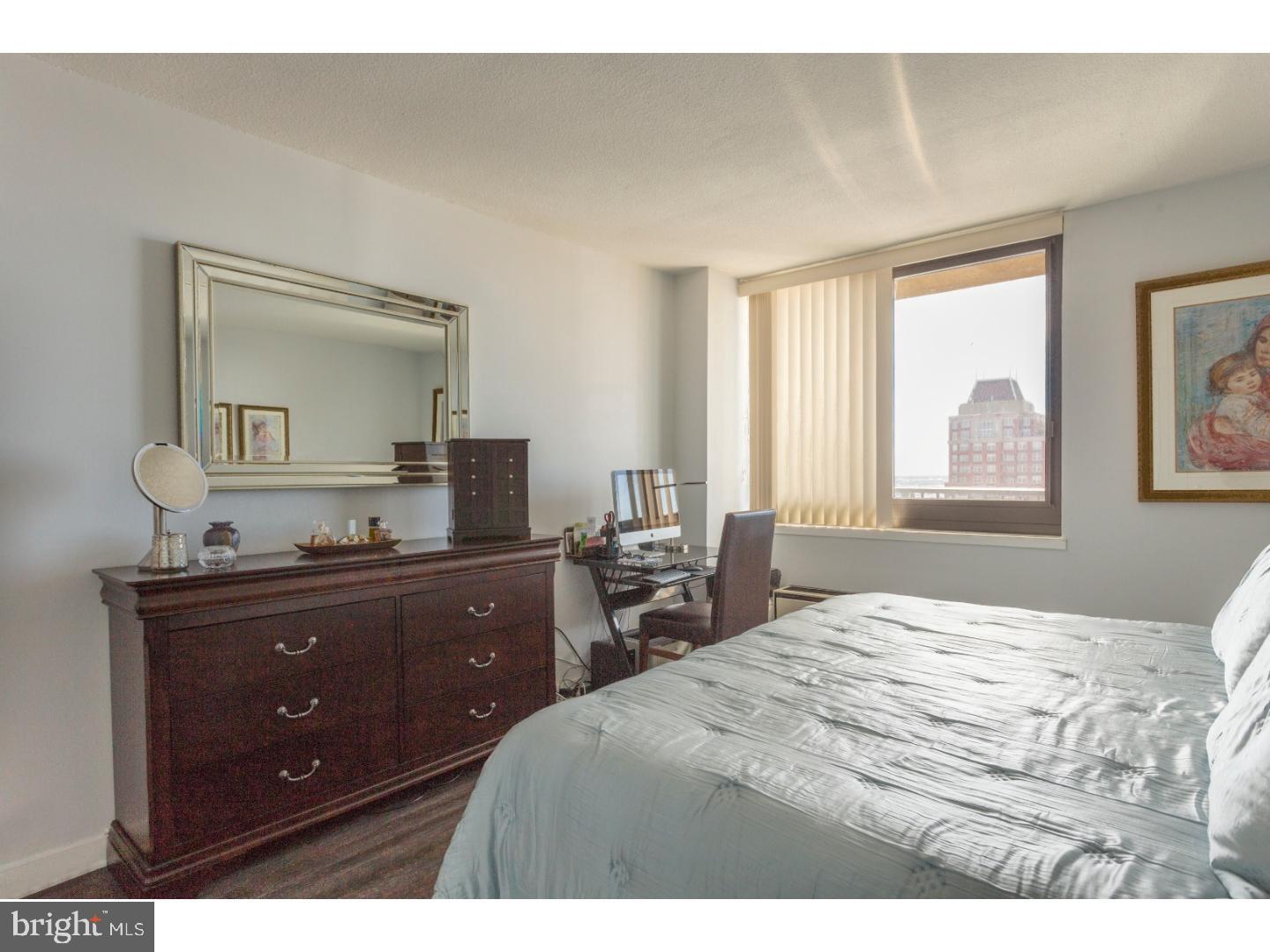 1420 Locust Street, Unit 29R Philadelphia, PA 19102 - Photo 11 of 30 a bedroom with a bed and a dresser