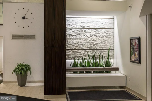 a bathroom with a glass shower door and a sink