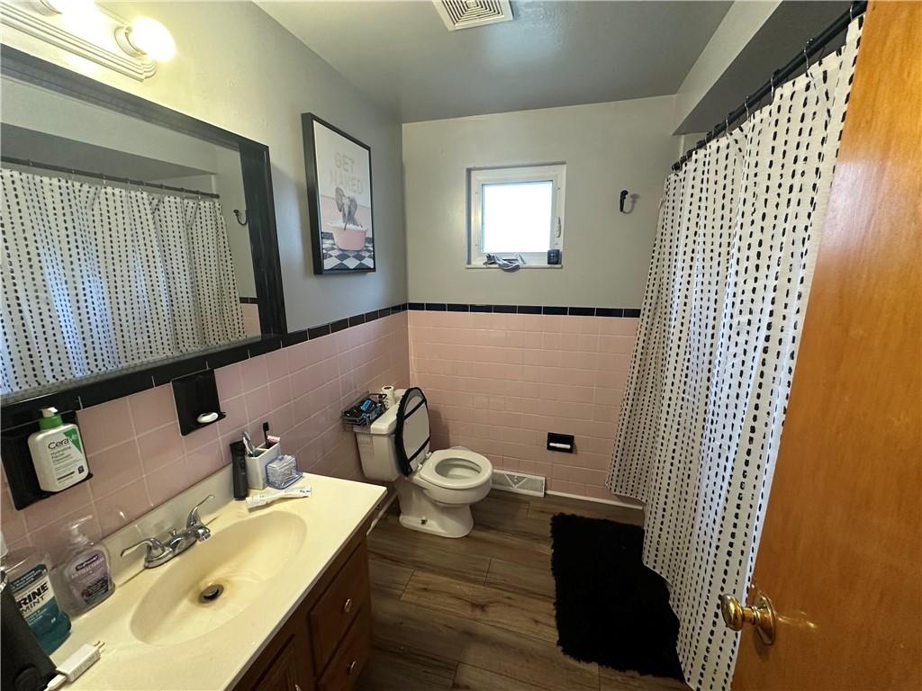 900 State Avenue Coraopolis, PA 15108 - Photo 13 of 19 a bathroom with a sink toilet and mirror