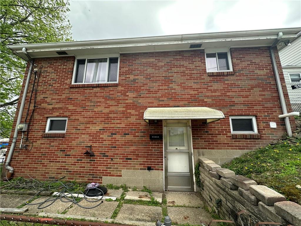 900 State Avenue Coraopolis, PA 15108 - Photo 2 of 19 a front view of a house with yard