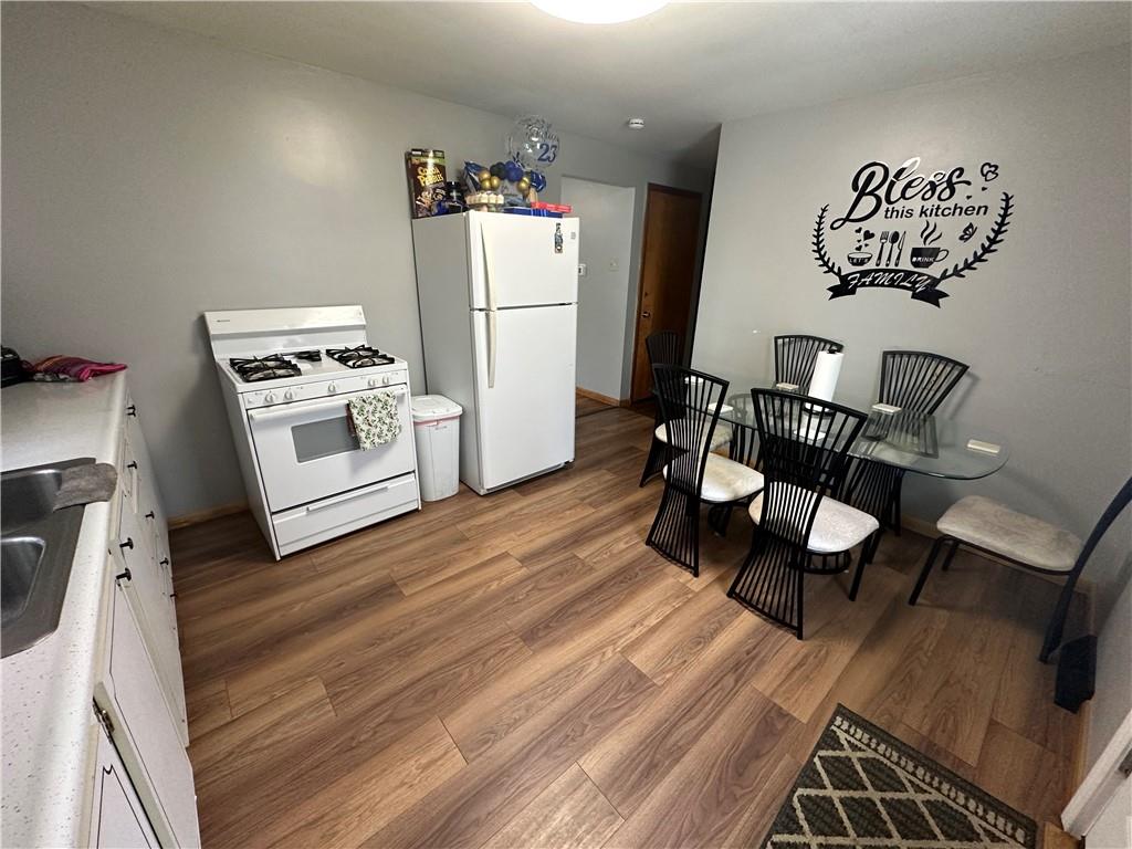 900 State Avenue Coraopolis, PA 15108 - Photo 6 of 19 a kitchen with a refrigerator and wooden floor