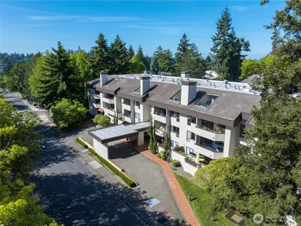 a aerial view of a house with a yard