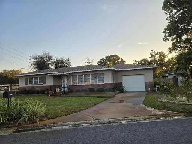 front view of a house with a small yard