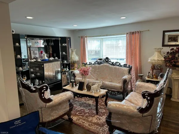 a view of a livingroom with workspace and a couch