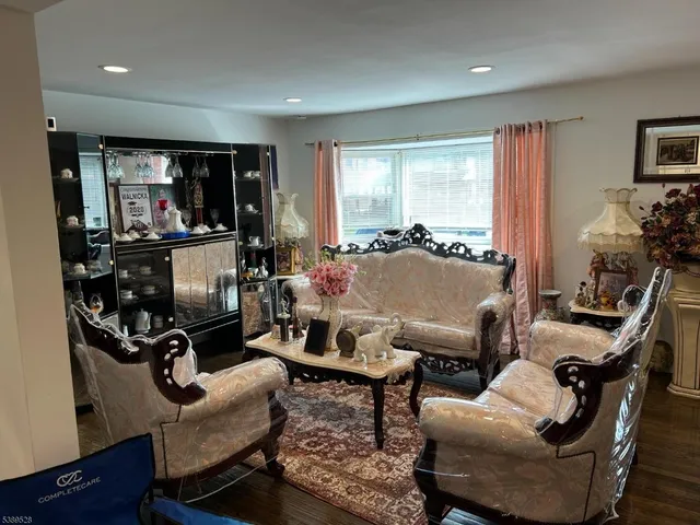 a view of a livingroom with workspace and a couch