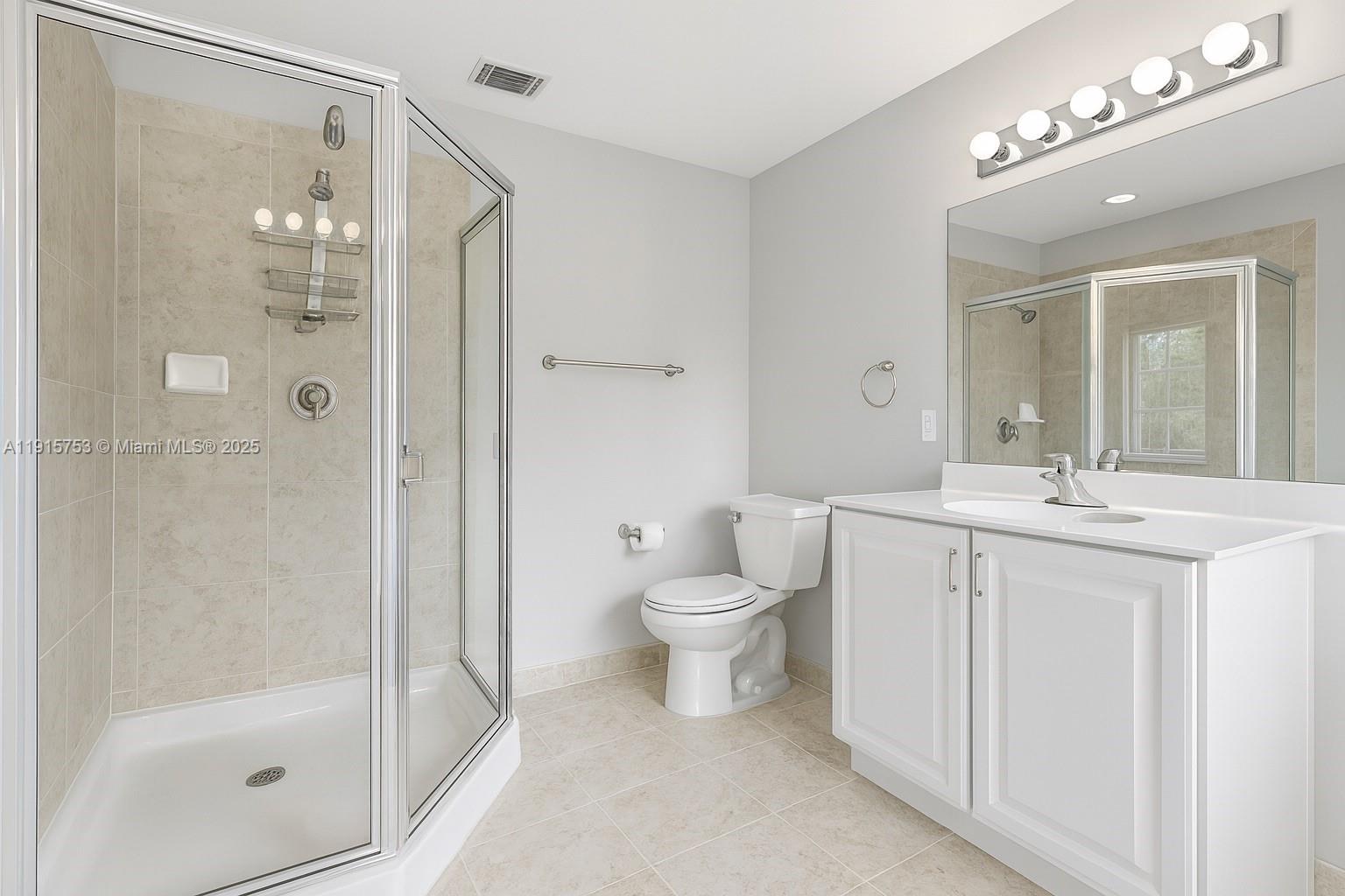 4581 Danson Way Delray Beach, FL 33445 - Photo 10 of 19 a bathroom with a toilet a sink and a mirror