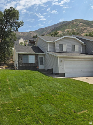 2159 Dakota Avenue Provo, UT 84606 - Photo 1 of 3 Two-story residence featuring light gray siding and a dark shingle roof