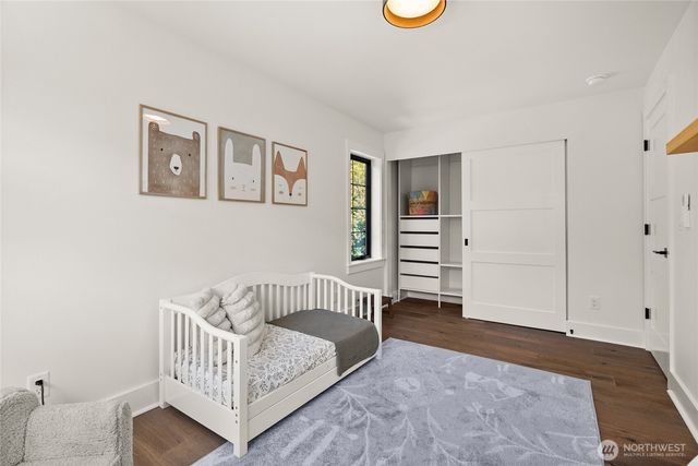 a bedroom with furniture and a window