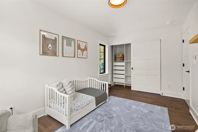 a bedroom with furniture and a window