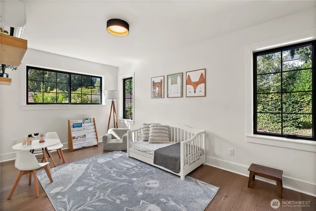 a bedroom with furniture and a window
