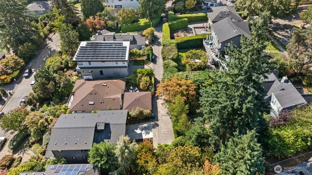 an aerial view of multiple houses with yard