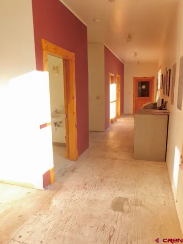 a view of a livingroom with chair and dining table