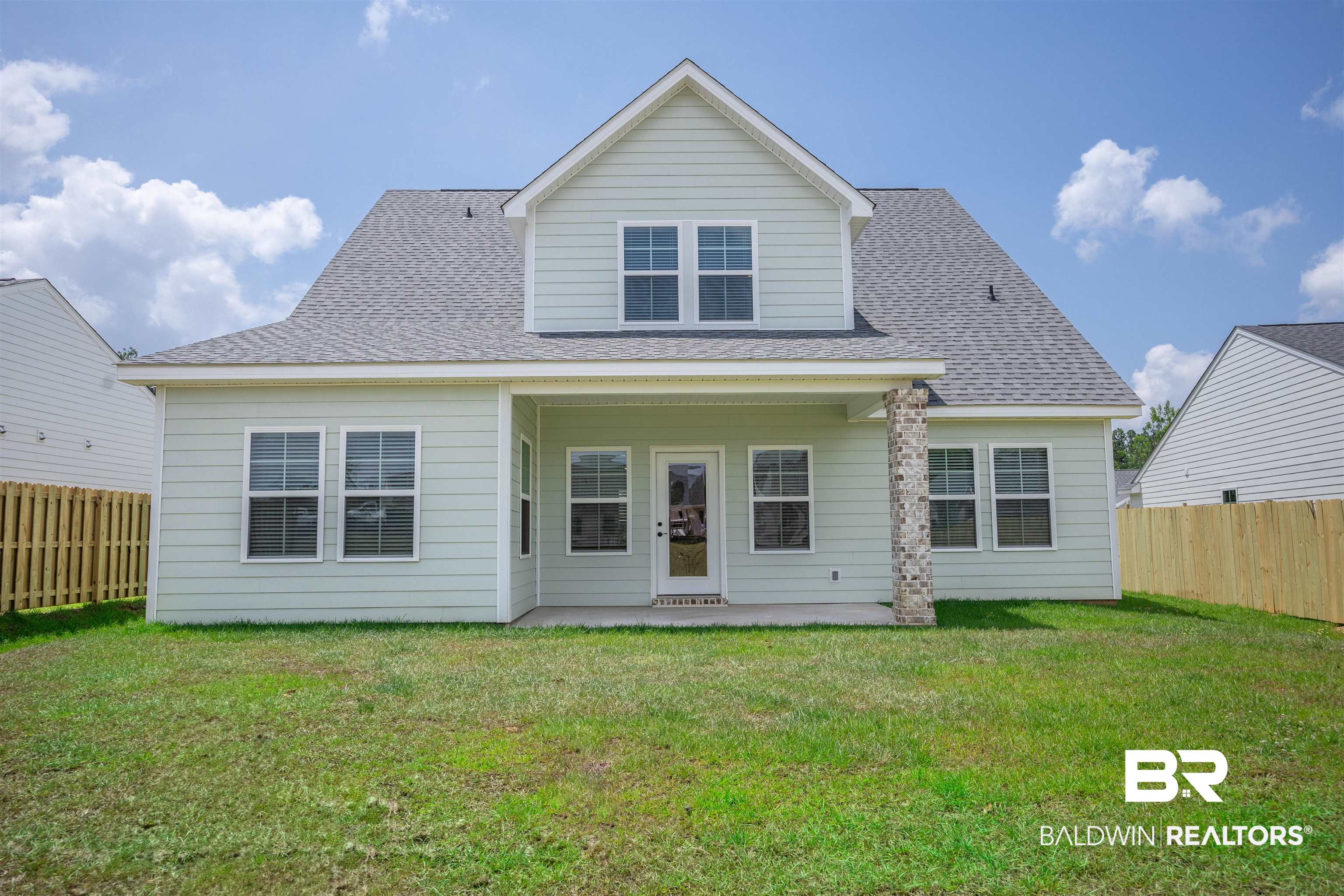 12894 Flanagan Street Elberta, AL 36530 - Photo 2 of 29 Rear view of house with a lawn