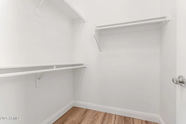 a view of a patio with table and chairs