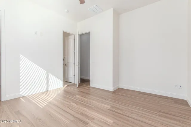 a view of a patio with table and chairs potted plants