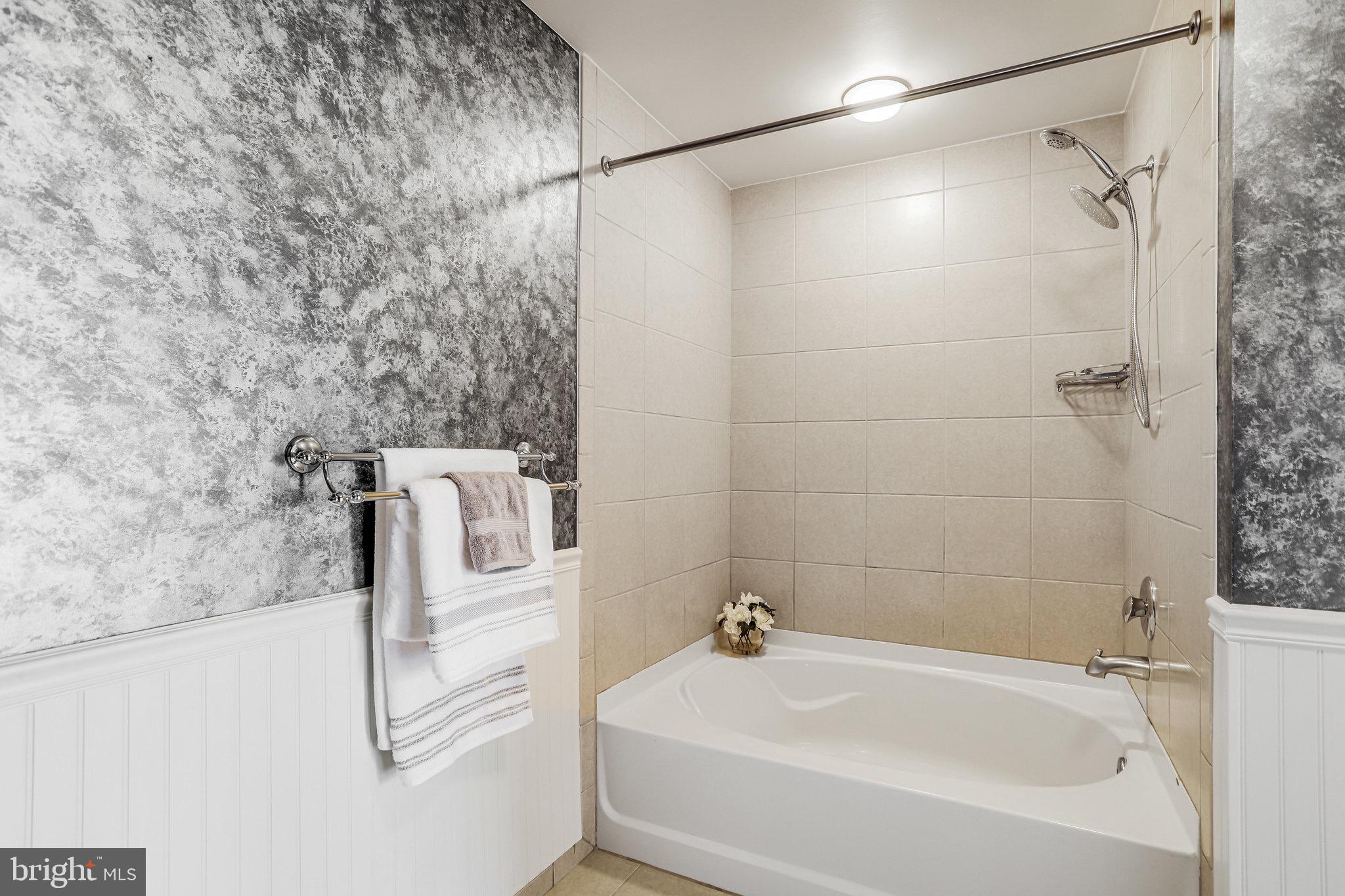 910 M Street Northwest, Unit 516 Washington, DC 20001 - Photo 13 of 29 a bathroom with a sink and a shower