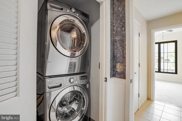 a view of a hallway with washer and dryer