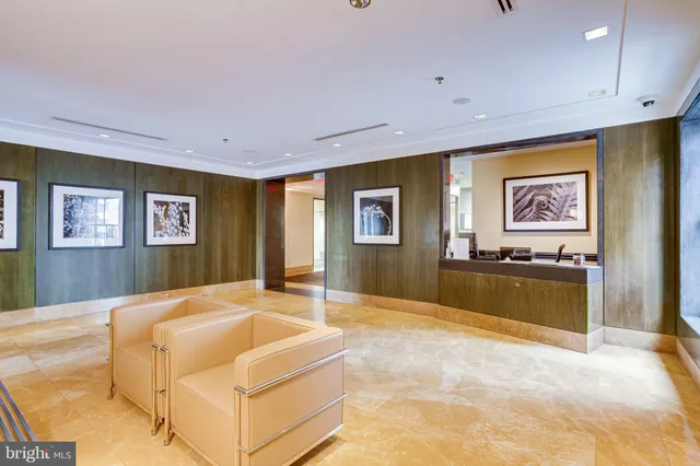 a spacious bedroom with a bed and a table in it