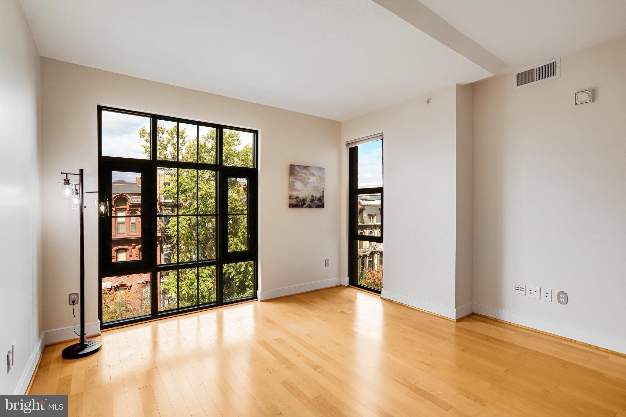 910 M Street Northwest, Unit 516 Washington, DC 20001 - Photo 7 of 29 a view of an empty room with a window
