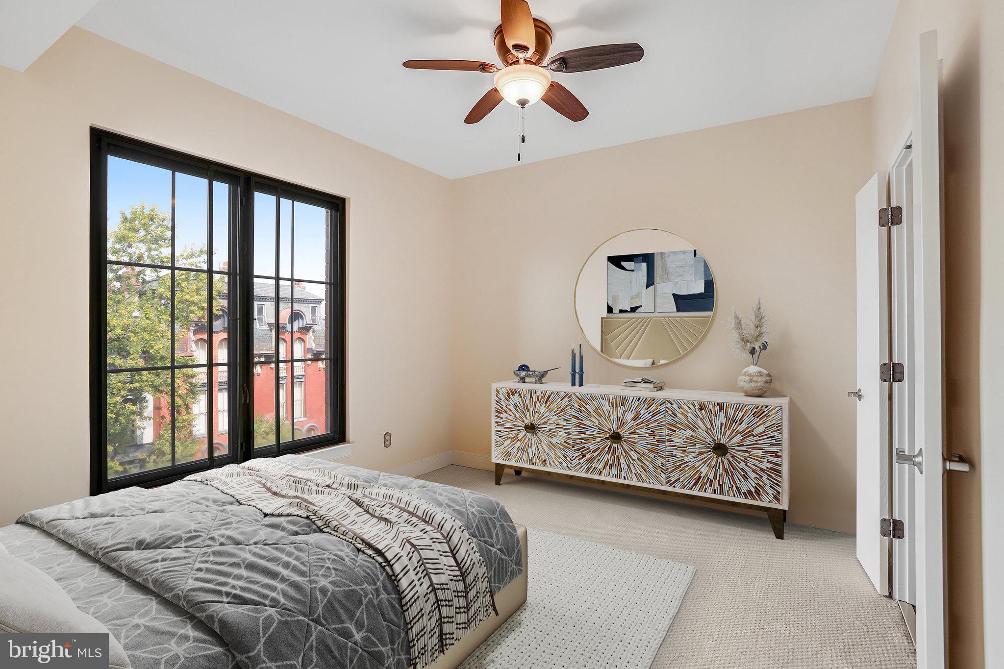 910 M Street Northwest, Unit 516 Washington, DC 20001 - Photo 8 of 29 a bedroom with a bed table and window
