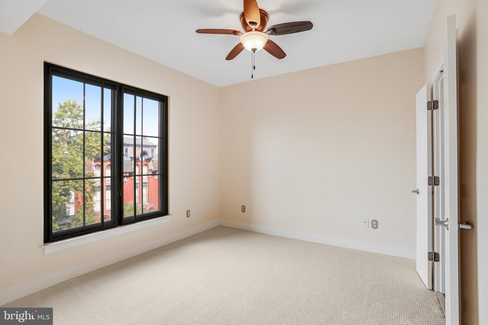 910 M Street Northwest, Unit 516 Washington, DC 20001 - Photo 9 of 29 a view of an empty room with a window