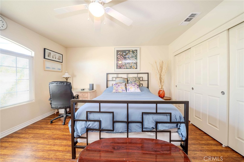 11522 Ponderosa Road Pinon Hills, CA 92372 - Photo 26 of 46 a view of a livingroom with furniture and wooden floor