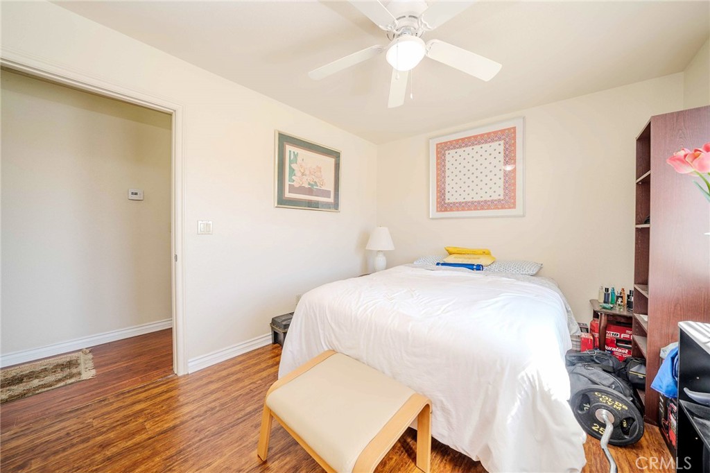 11522 Ponderosa Road Pinon Hills, CA 92372 - Photo 29 of 46 a bedroom with a bed and a chandelier