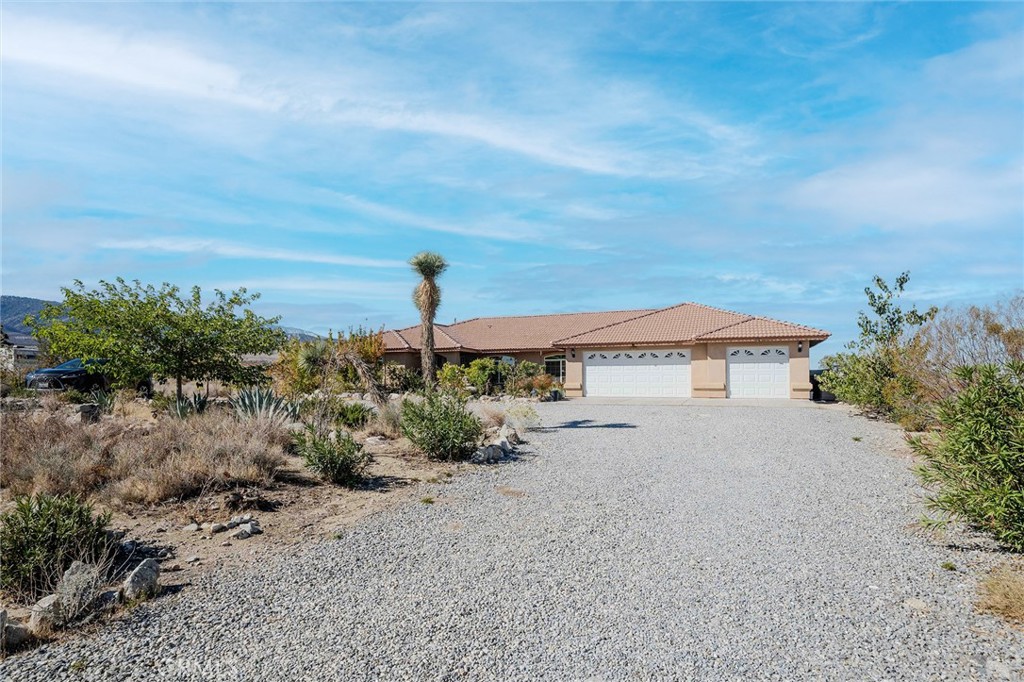 11522 Ponderosa Road Pinon Hills, CA 92372 - Photo 4 of 46 a view of a house with a garden