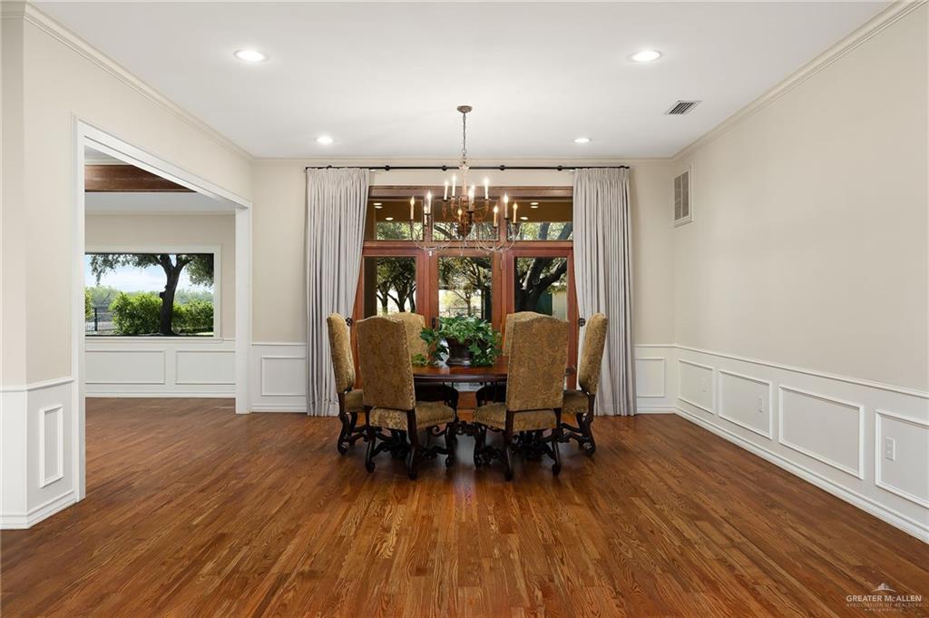 4725 Mile 6 Road McAllen, TX 78504 - Photo 14 of 45 a view of a dining room with furniture window and wooden floor