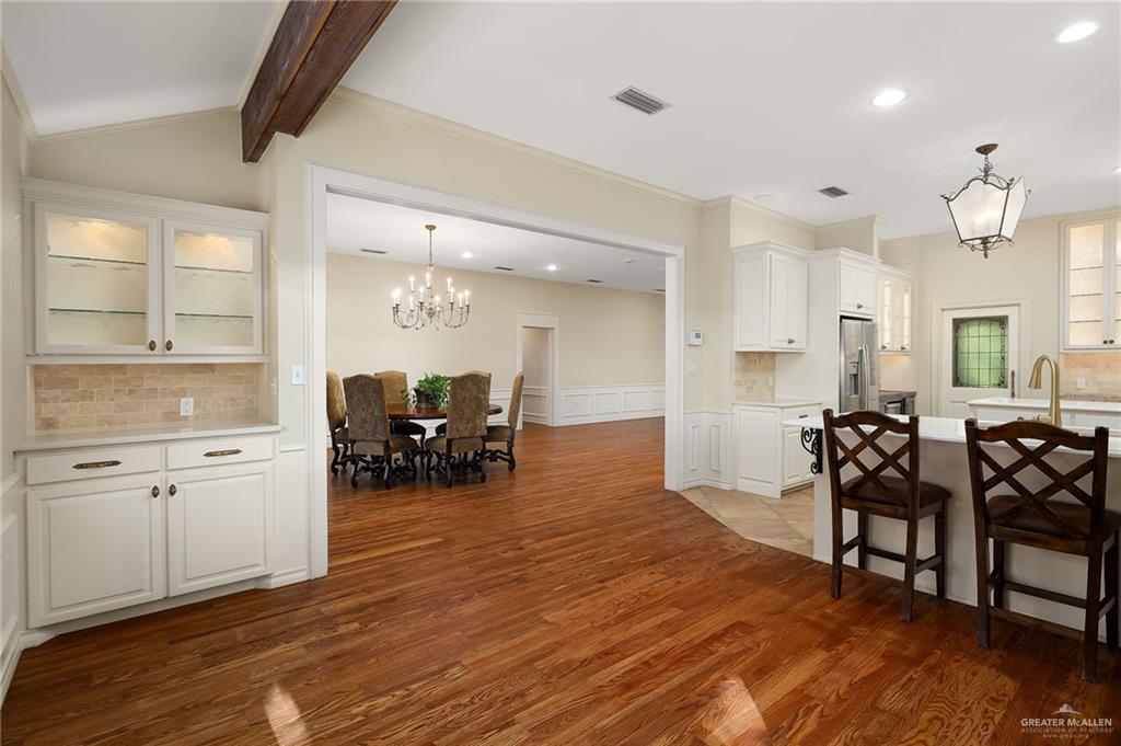 4725 Mile 6 Road McAllen, TX 78504 - Photo 17 of 45 a view of a dining room with furniture and wooden floor