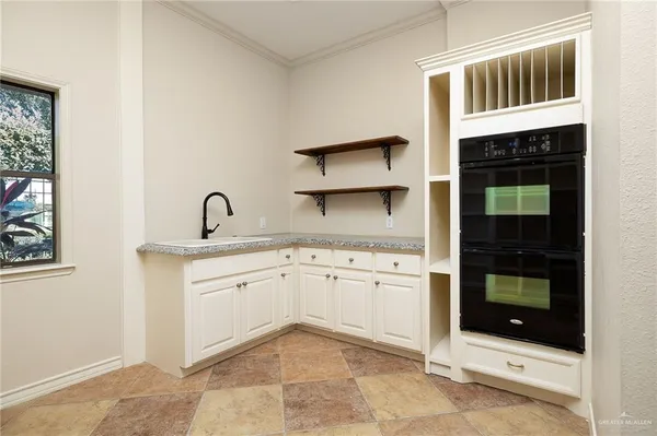 a kitchen with a sink and cabinets
