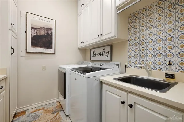 a view of kitchen with stainless steel appliances granite countertop a stove and a wooden floor