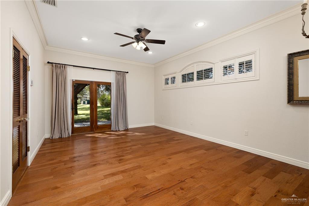 4725 Mile 6 Road McAllen, TX 78504 - Photo 29 of 45 a view of an empty room with window and wooden floor