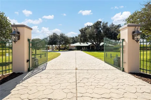 a view of swimming pool with a patio and a yard