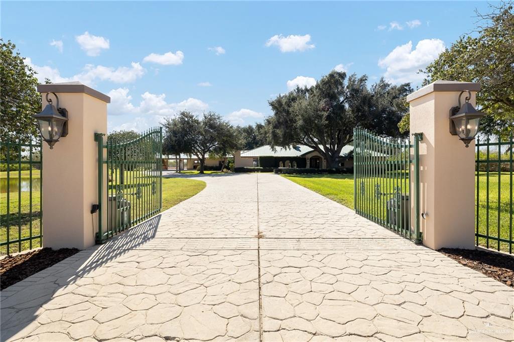 4725 Mile 6 Road McAllen, TX 78504 - Photo 3 of 45 a view of swimming pool with a patio and a yard
