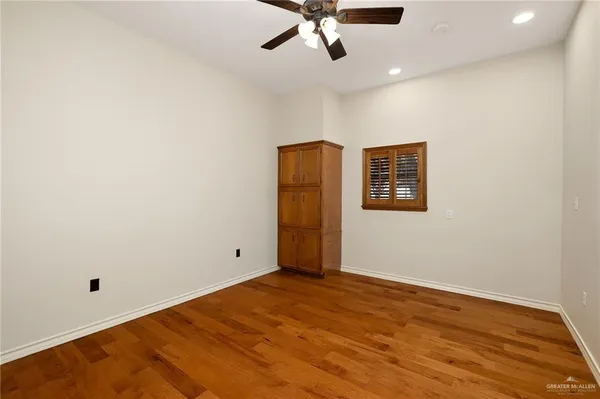 a en suite bathroom with a granite countertop sink mirror and a