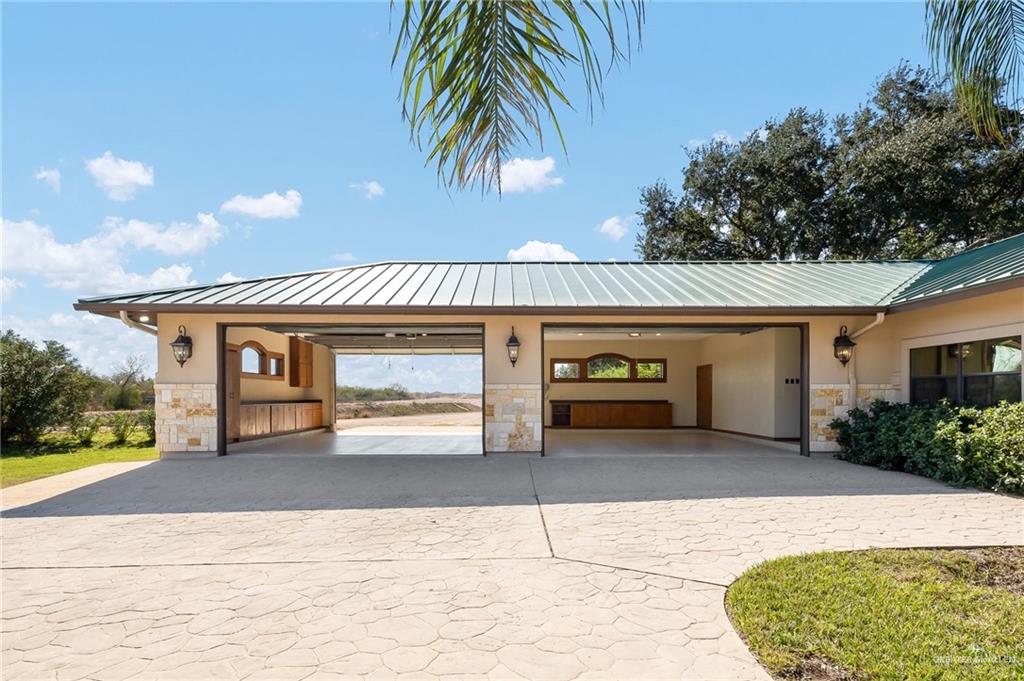 4725 Mile 6 Road McAllen, TX 78504 - Photo 43 of 45 a front view of a house with garden