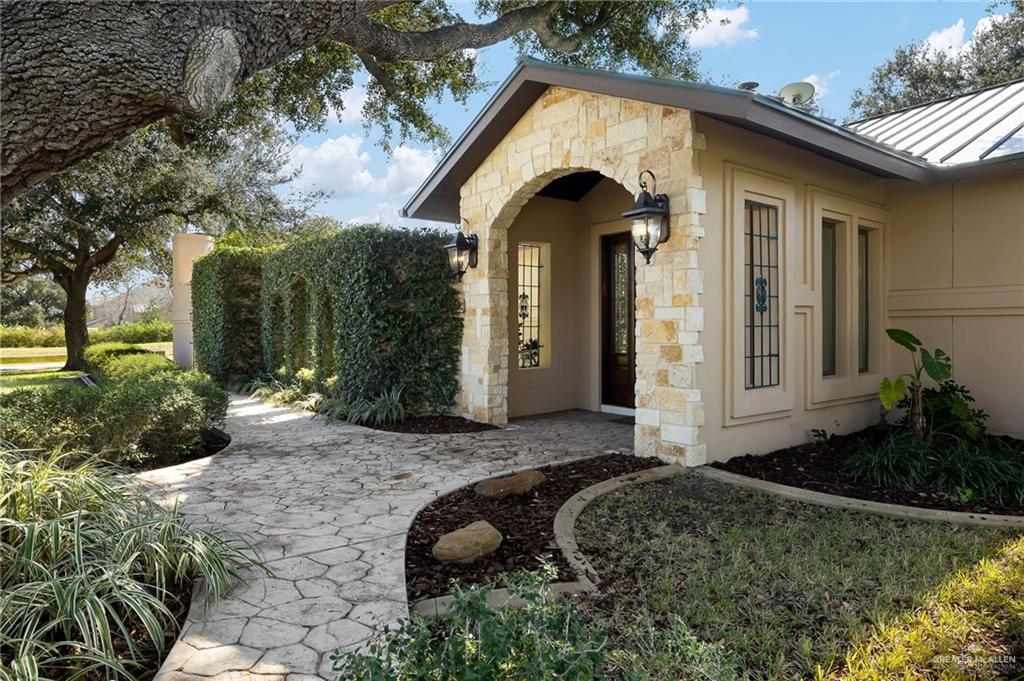 4725 Mile 6 Road McAllen, TX 78504 - Photo 5 of 45 a front view of a house with garden