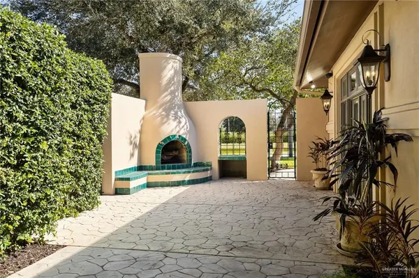 a view of a house with a yard and plants