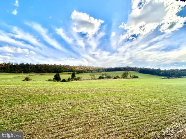 a view of an ocean and a mountain