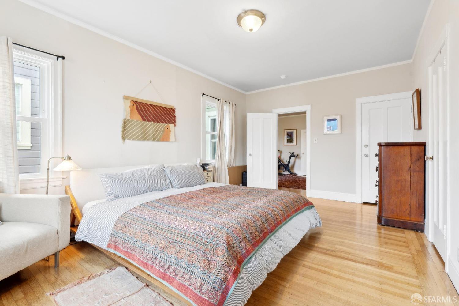 368 Funston Avenue San Francisco, CA 94118 - Photo 13 of 16 a bedroom with bed and wooden floor