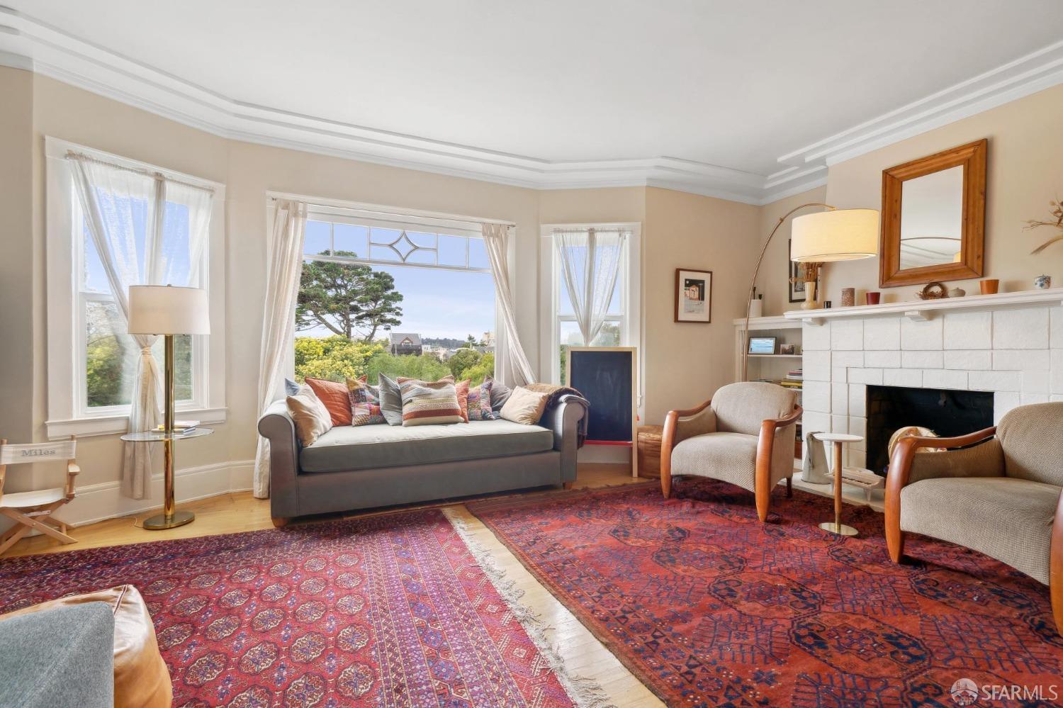 368 Funston Avenue San Francisco, CA 94118 - Photo 2 of 16 a living room with furniture and a fireplace