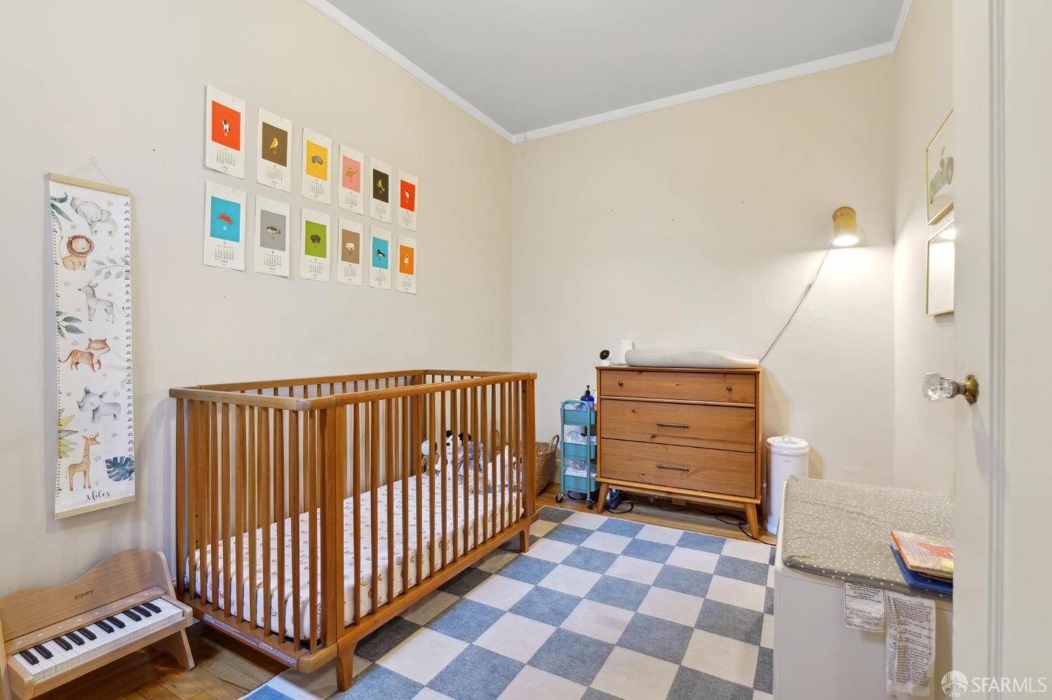 368 Funston Avenue San Francisco, CA 94118 - Photo 7 of 16 a view of a hallway with closet and wooden floor