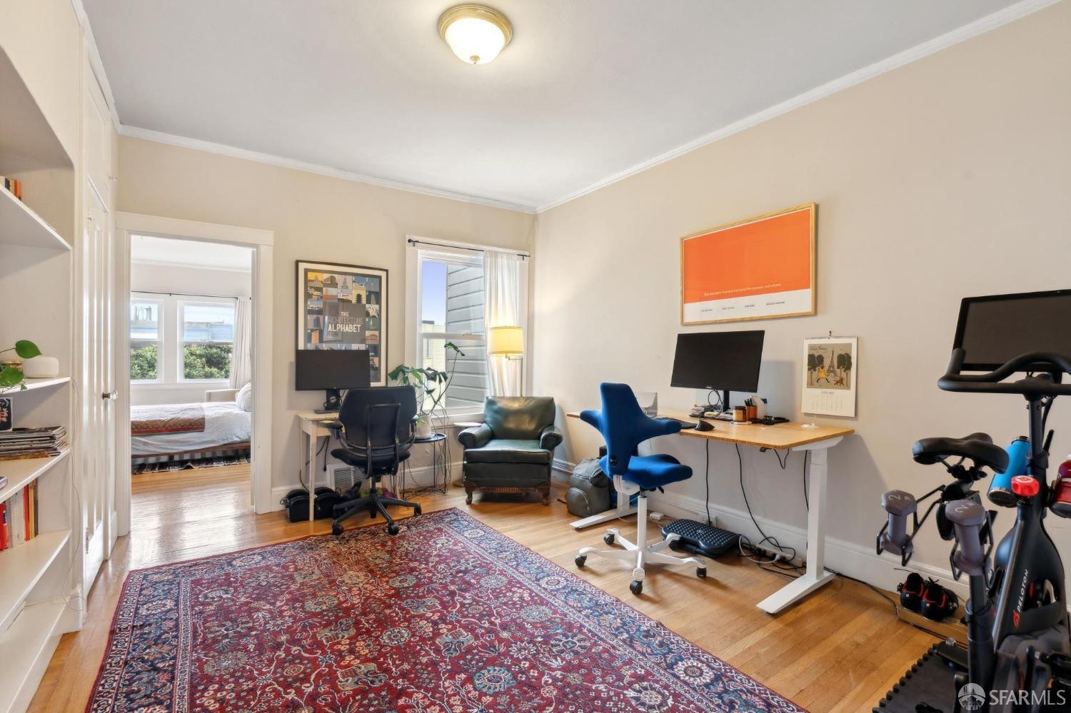 368 Funston Avenue San Francisco, CA 94118 - Photo 10 of 16 a living room with furniture a rug and a flat screen tv