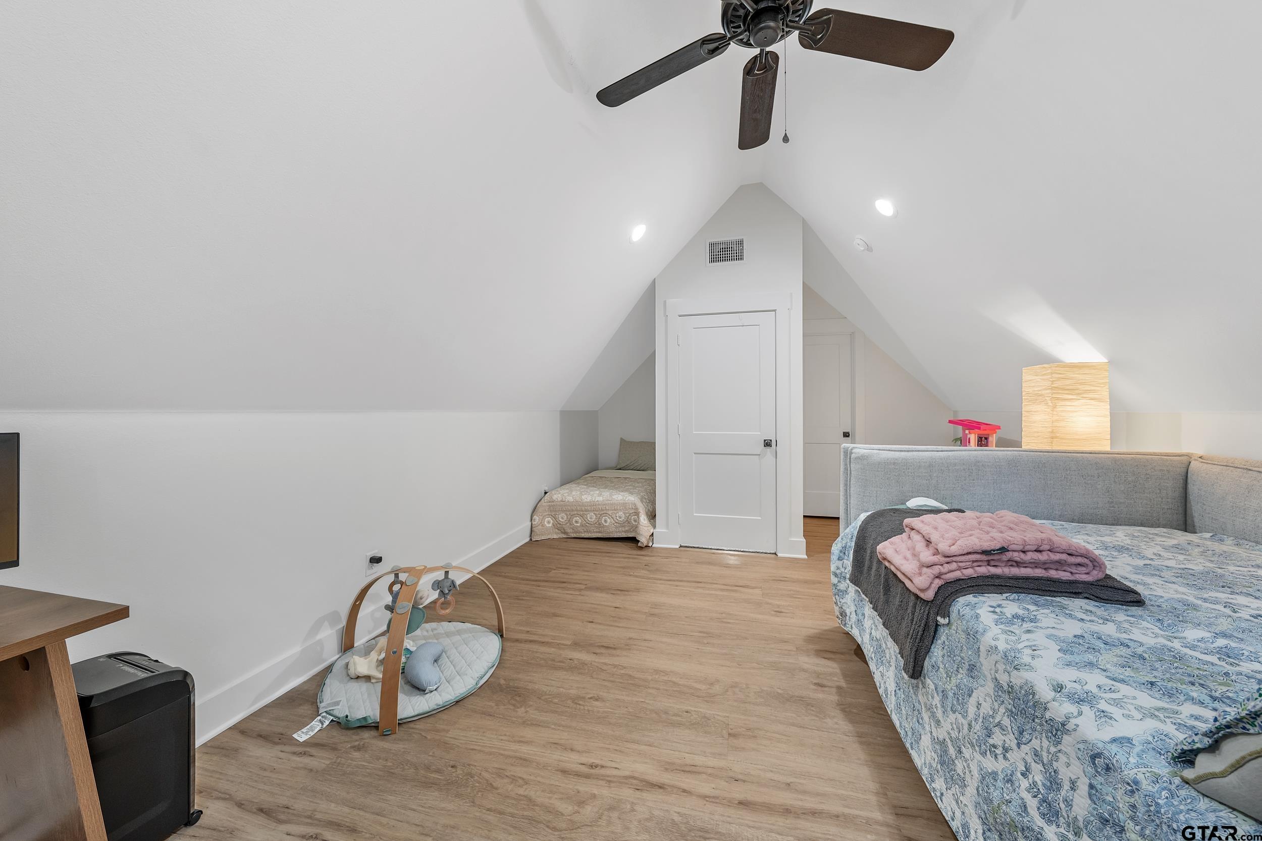 16837 Wilson Road Tyler, TX 75707 - Photo 27 of 44 a bed room with a bed and a chair