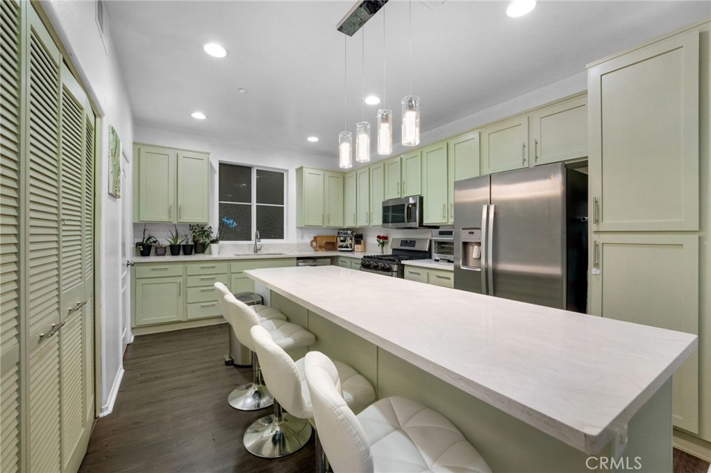 1572 Hackberry Place Chula Vista, CA 91915 - Photo 1 of 38 a kitchen with refrigerator and chairs