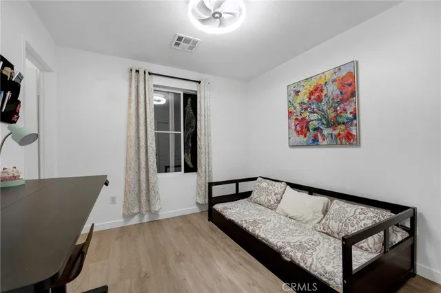 a view of a livingroom with furniture and wooden floor