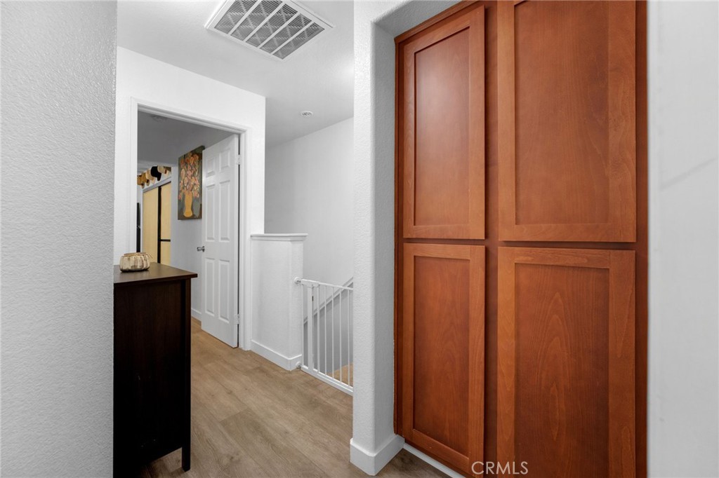 1572 Hackberry Place Chula Vista, CA 91915 - Photo 21 of 38 a view of a hallway with wooden floor